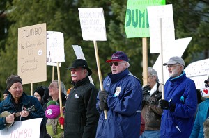 Jim Galloway, centre, at the protest in front of Village of Radium Hot Springs office prior to the first ever JGMRM council meeting. Ian Cobb/e-KNOW file photo