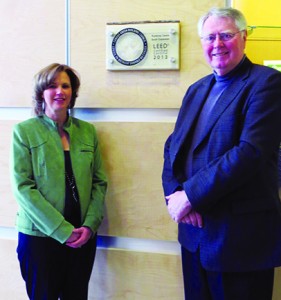 College of the Rockies’ Vice-President of Finance Dianne Teslak and President and CEO Nick Rubidge proudly show off the college’s LEED certification plaque, displayed in the newly constructed south entrance.