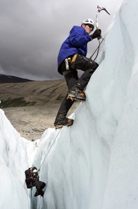 Graham Kinley models for Curtis Hall's camera on Robson glacier.  Photo by Pat Morrow