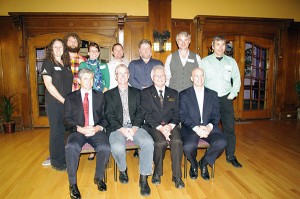 At back, left to right: Bonnie Castle-Dixon of Tipi Mountain Native Plants, Chris Gallagher of TerraLogic Exploration, Jana Skerlak of Bullet Point Marketing, Steve Fisher of Golden Environmental Mat Services (GEMS), Mike Keefer of Keefer Ecological Services, Paul von Wittgenstein of Baby World Language, James Swansburg of Landmax. Front from left: Minister Andrew Wilkinson, Don McCormick, Mayor Wayne Stetski and Dean Prelazzi. Ian Cobb/e-KNOW 