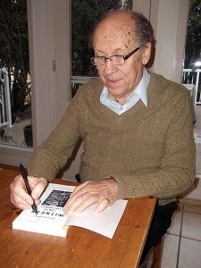 George Horak signs a copy of his book earlier this year. Douglas Mitchell photos