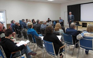 Denis Petryshen address the audience at the Town Hall Meeting in Wardner, May 29.