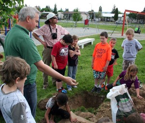 Students receive a lecture on soil.