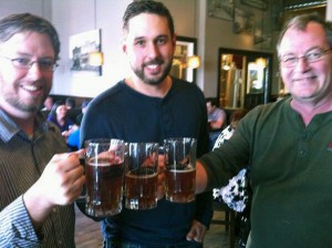 City of Cranbrook Director of Communications Chris Zettel, Chris Botterill of Genex Marketing and a beery old journalist toast Sam Steele Days.