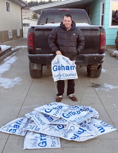 Wesly Graham with a pile of vandalized signs from Victoria Ave. Photo submitted