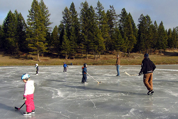 A game of hockey breaks out on the ice at the Nature Conservancy of Canada’s Winter Celebration on Marion Creek Benchlands on Sunday, December 14. Photo by NCC