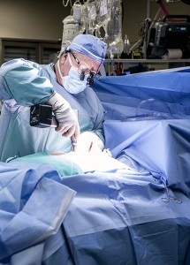 Dr. Guy Fradet performs open heart surgery. More than 1,000 such procedures have been performed since the program began in December 2012.