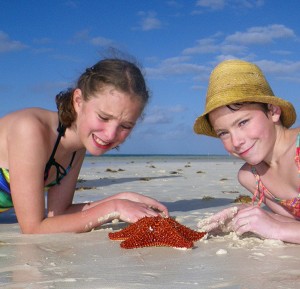 My girls with one of the massive starfish they found on the beach at the resort.