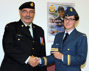 Taking Command: Major Jerry Gregr presents newly-appointed Commanding Officer Sherri Shaw with her rank insignias. Captain Shaw is taking over command of the Elk Valley Air Cadets from former commanding officer, Captain Murray Clow, who has been with the squadron for 11 years. (Photo S. Furedi)