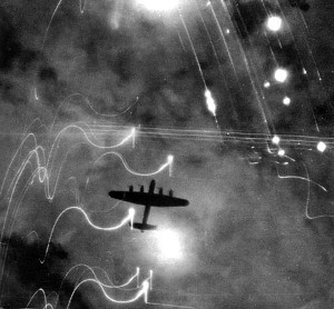 This photo shows the difficulty of striking the target at night, especially when the aircraft is surrounded by bursting flak and tracers from the anti-aircraft guns. Photo Credit: Wikipedia