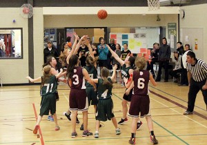 Sparwood versus Fernie. You will note the stands were full and there was standing room only by the entrance to the gym.