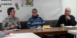 Volunteers Paul Willis (l) and Colin MacKenzie (right) listening to Rev. Elizabeth Huether (centre).