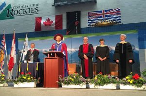 VP Academic & Applied Research, Dr. Stan Chung, addresses the crowd as President David Walls, Dr. Jack Moes - Dean of Trades & Technology, Heather Hepworth - Dean of Health & Human Services and faculty member Dr. David Dyck look on.