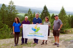 Funders, trail organizers and volunteers gathered at a site along the Mayook stretch of the Cranbrook to Wardner Trail Wednesday to celebrate a funding announcement that will allow the completion of the trail.
