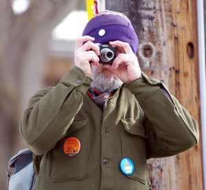 Arnor takes photos during the demonstration outside the Village of Radium Hot Springs offices, prior to the first-ever Jumbo Glacier Mountain Resort Municipality council meeting on Feb. 19, 2013. Ian Cobb/e-KNOW file photo