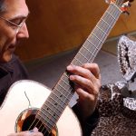 Fingerstyle guitarist playing Arts Station